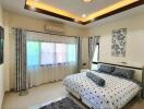 Spacious modern bedroom with king-sized bed and elegant interior design