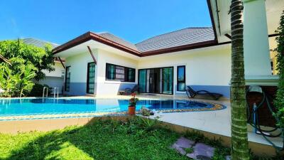 Modern house with swimming pool in a sunny day