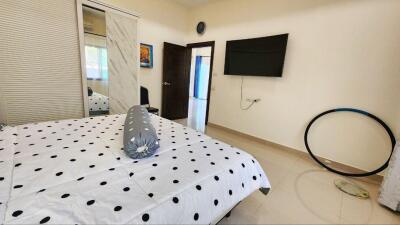 Spacious bedroom with modern amenities and natural light