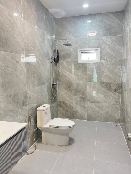 Modern bathroom with marble tiles and shower