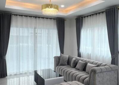 Elegant living room with modern decor and plush seating