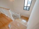 Bright and airy staircase with wooden flooring