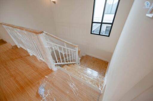 Bright and airy staircase with wooden flooring