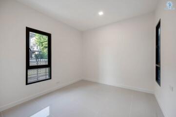 Spacious and bright empty bedroom with large windows