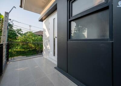 Spacious balcony with modern railing and tiled flooring