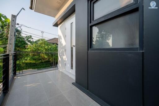 Spacious balcony with modern railing and tiled flooring