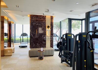 Modern in-home gym with exercise equipment and natural light