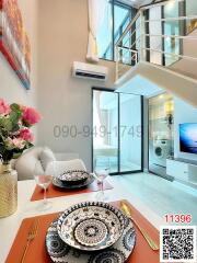 Modern living room with high ceiling and mezzanine