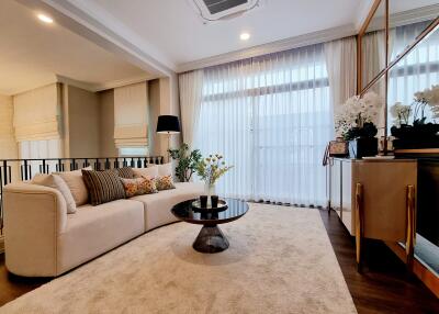 Elegant living room interior with large sofa and stylish decor