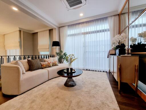 Elegant living room interior with large sofa and stylish decor