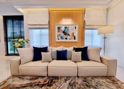 Elegant living room interior design with comfortable sofa and artistic decorations
