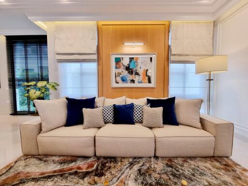 Elegant living room interior design with comfortable sofa and artistic decorations