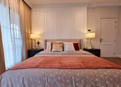 Elegantly furnished bedroom with a large bed and sophisticated interior