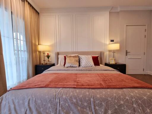 Elegantly furnished bedroom with a large bed and sophisticated interior