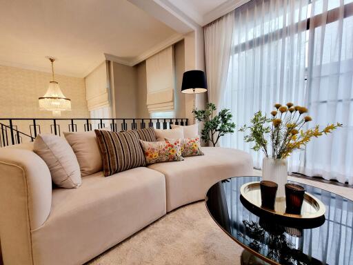 Elegant living room with beige sofa and modern decor