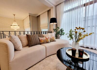 Elegant living room with beige sofa and modern decor