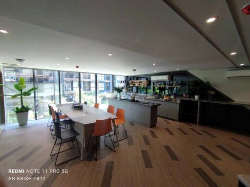 Spacious modern kitchen with dining area and large windows