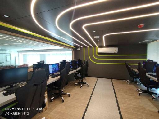 Modern office interior with dynamic lighting and workstations
