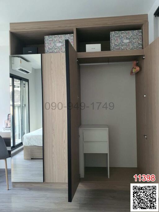 Modern bedroom with built-in wardrobe and air conditioning unit