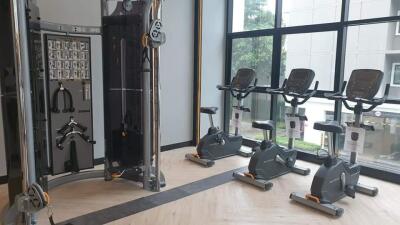 Modern gym facility with exercise equipment inside a residential building