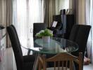 Modern dining room with glass table and comfortable seating