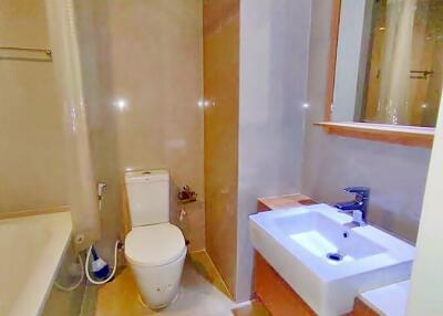 Modern bathroom with glass shower and white sanitary ware