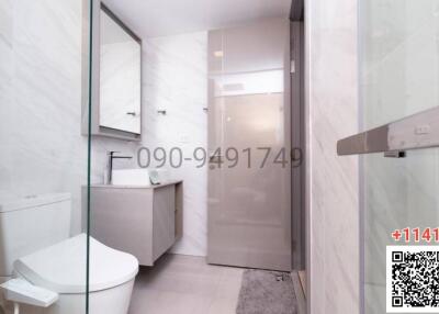 Modern bathroom interior with glass shower partition