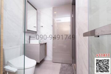 Modern bathroom interior with glass shower partition