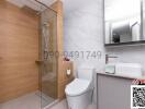 Modern bathroom interior with glass shower, wooden elements, and white fittings