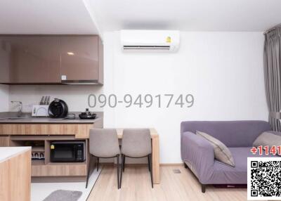 Compact studio apartment with integrated kitchen and living space