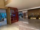 Elegant hotel or apartment building lobby with modern furnishings and glossy floors