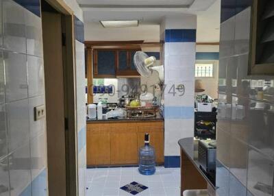 Compact kitchen with blue and white tile design