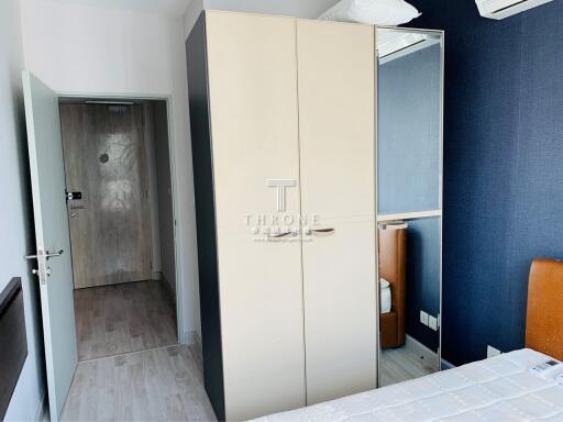 Modern bedroom interior with large wardrobe