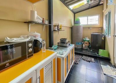 Modern kitchen with black appliances and wooden cabinets