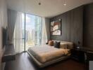 Modern bedroom with large window and city view