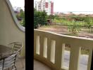 Spacious balcony with a view of the surroundings and outdoor seating