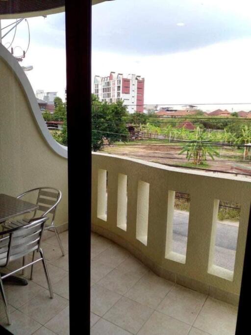Spacious balcony with a view of the surroundings and outdoor seating