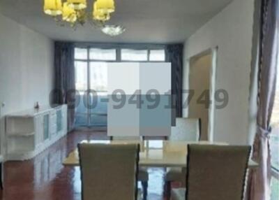 Spacious dining room with natural light and elegant flooring