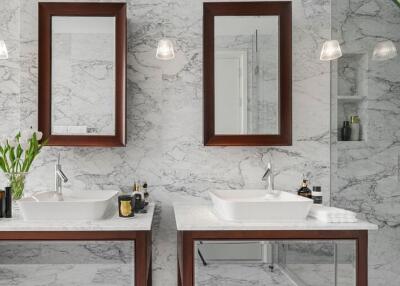 Modern bathroom with dual sinks and marble countertop