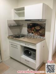 Compact modern kitchen with microwave and sink