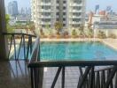 Balcony with city view and pool