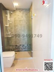 Modern spacious bathroom with shower and toilet