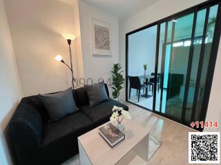 Modern Living Room with Large Sliding Glass Door and View into Dining Area