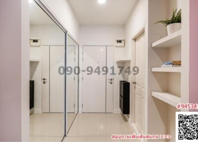 Compact entrance hallway with built-in storage and mirrors