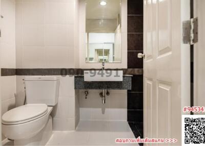 Modern bathroom interior with tiled walls and floor