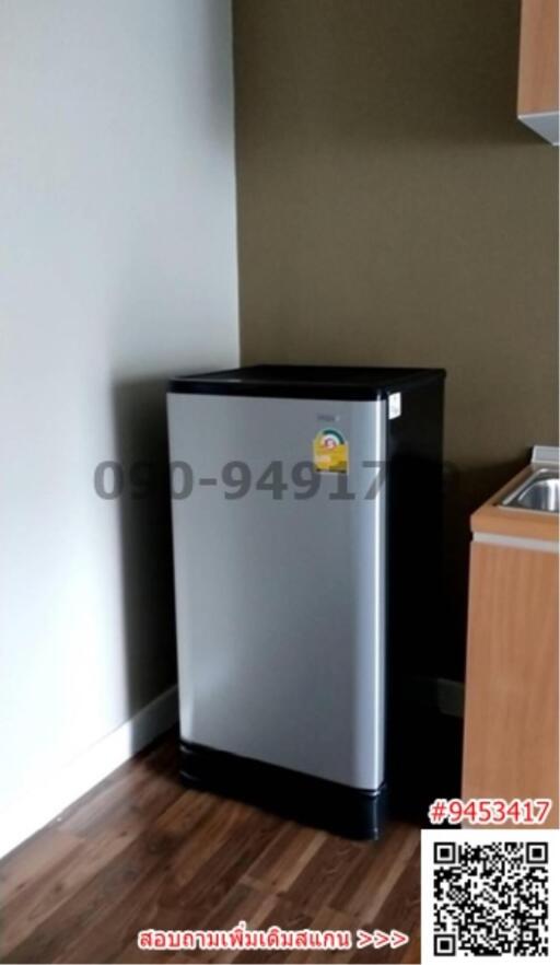Compact fridge in the corner of a modern kitchen