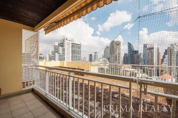 Spacious balcony with city skyline view