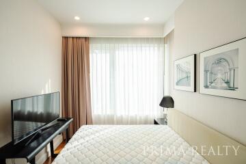 Modern bedroom with natural light and elegant decor