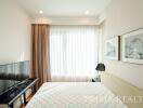 Modern bedroom with natural light and elegant decor