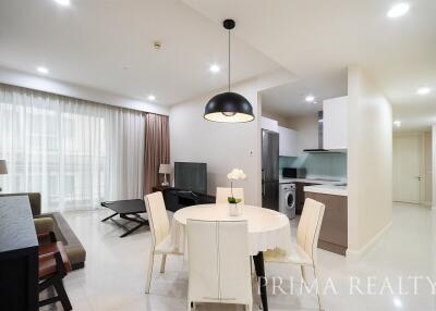 Spacious combined living room and kitchen area with modern furnishings